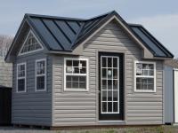 10x12 Custom Victorian Deluxe Storage Shed with vinyl siding, standing seam metal roofing, and additional windows